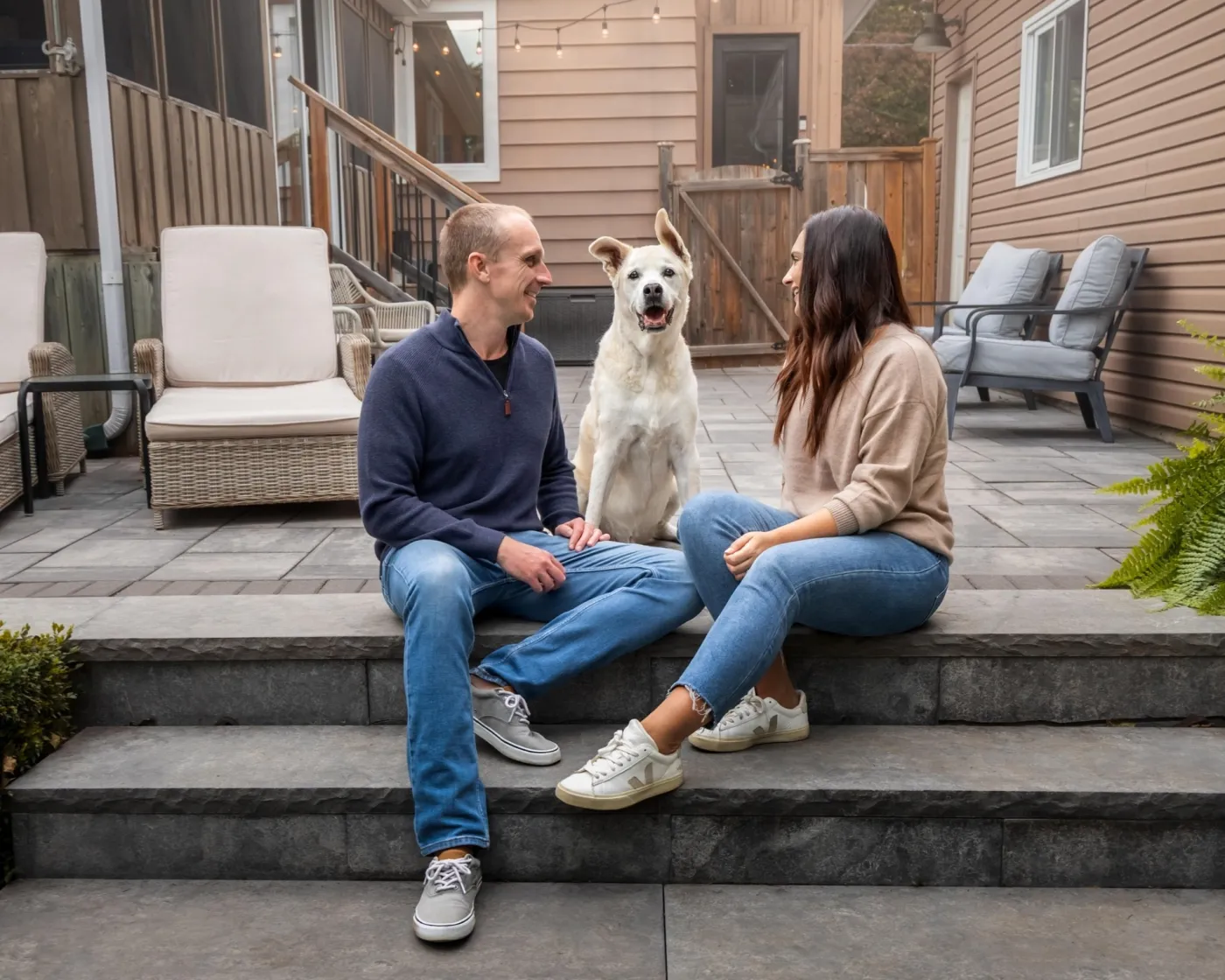 Danny, Amanda, and Bailey relaxing on the back patio